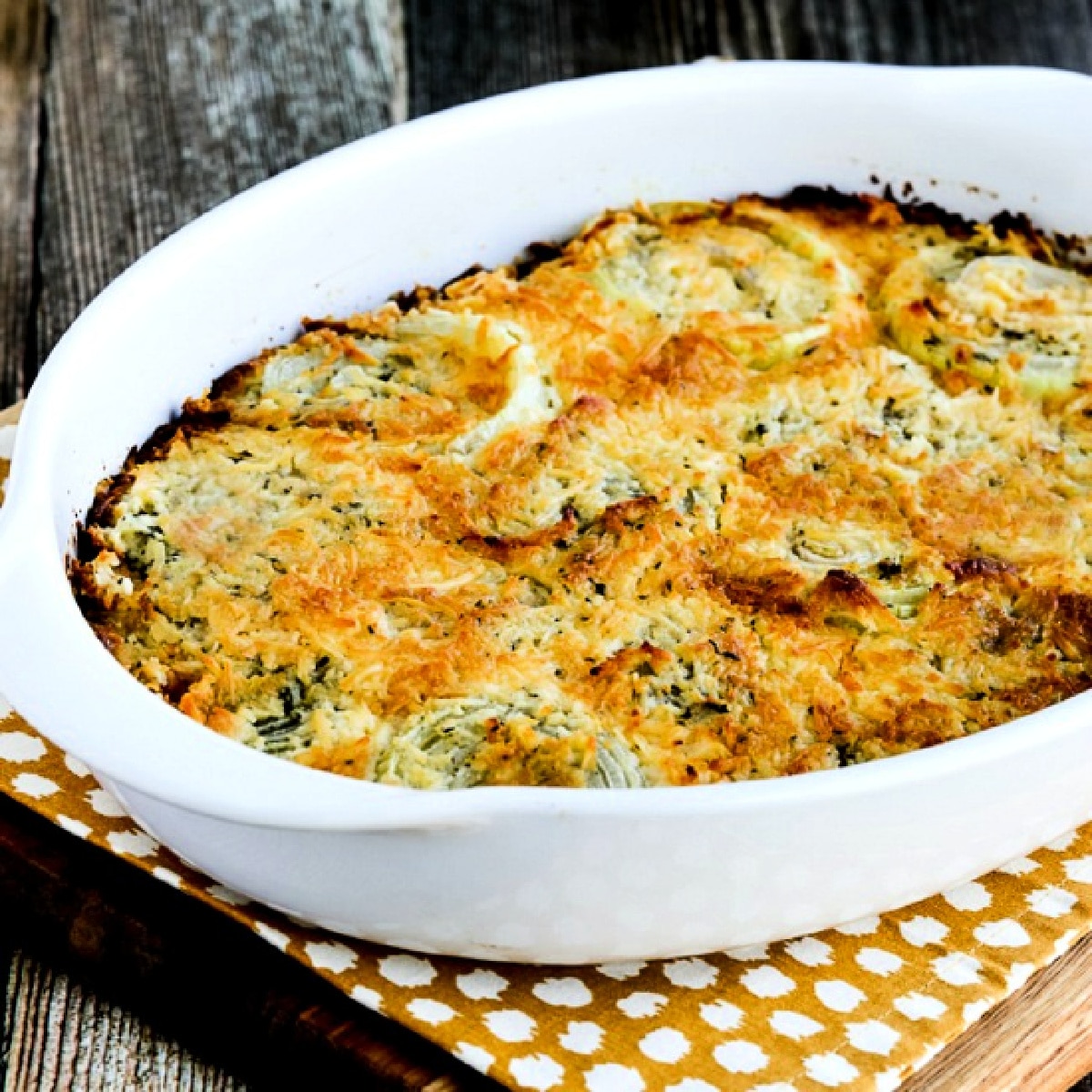 Square image for Onion Gratin shown in baking dish.
