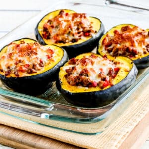 Sausage Stuffed Acorn Squash in baking dish, square image
