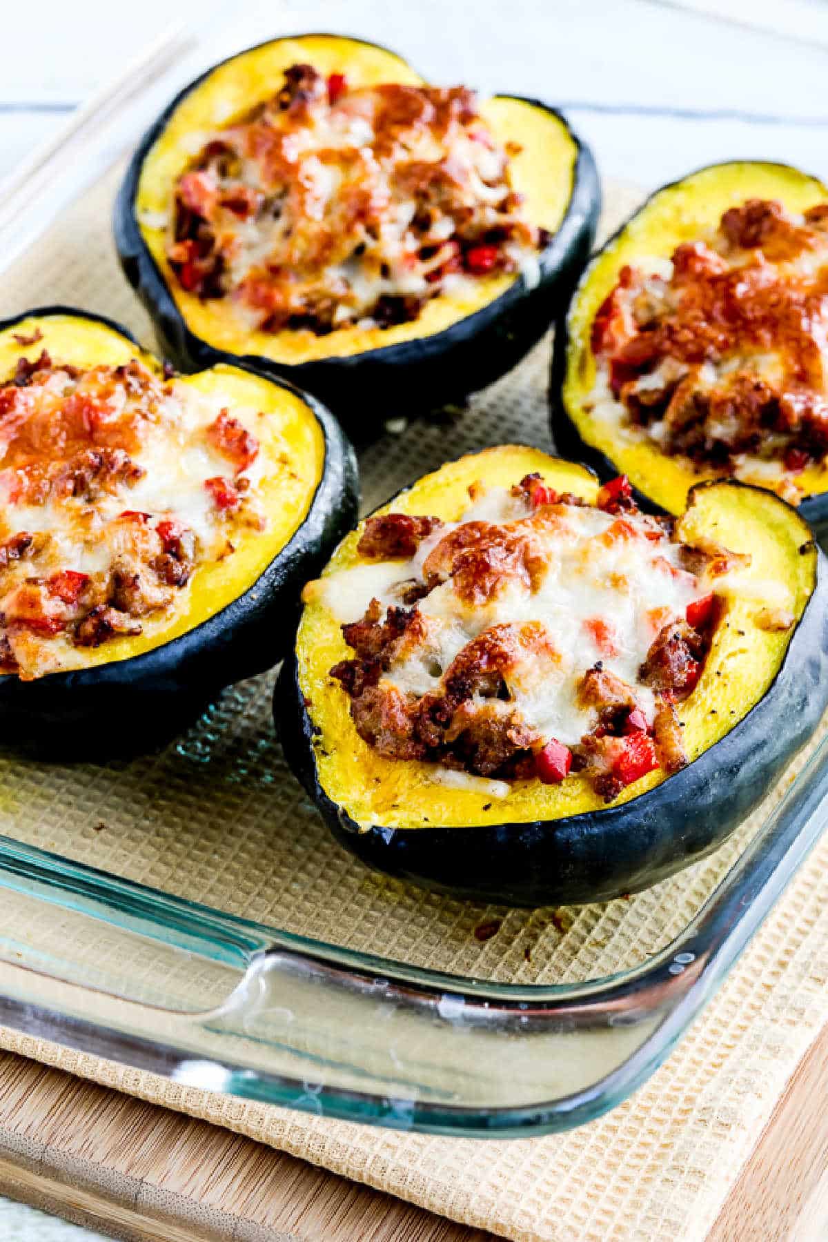 Sausage stuffed with acorn squash as shown in baking dish