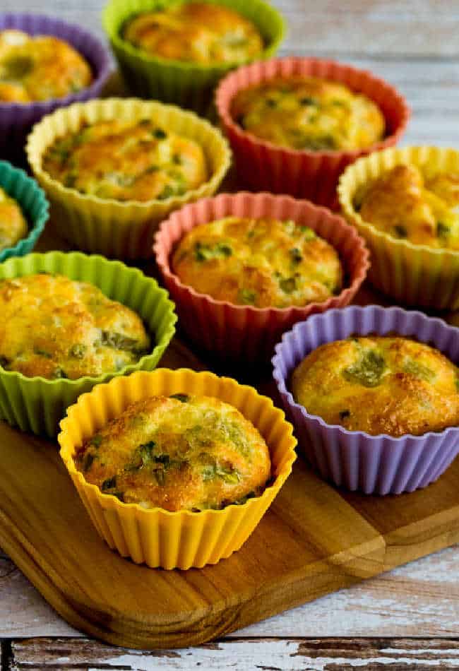 green chile and cheese egg muffins in baking cups on cutting board