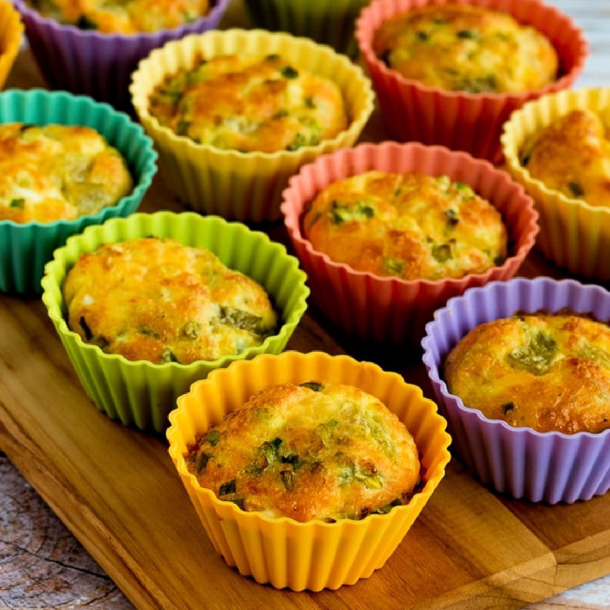 Square image for Green Chile and Cheese Egg Muffins shown in silicone baking cups.