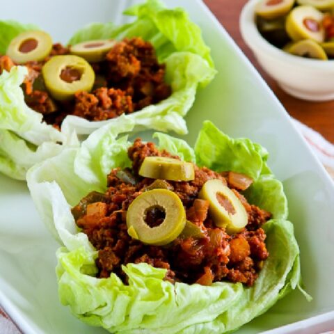Turkey Picadillo Lettuce Wraps close-up photo of two lettuce wraps in dish