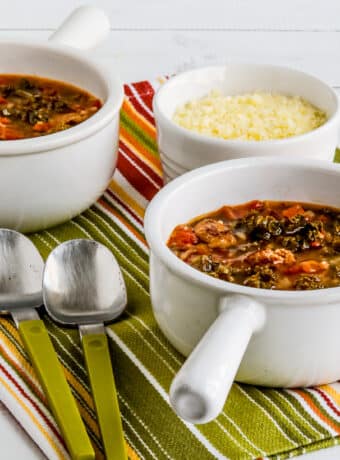Square image for Slow Cooker Sausage Stew shown in two serving bowls.