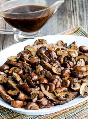 Square image of Slow Cooker Mushroom Lover's Pot Roast with pot roast on serving platter.