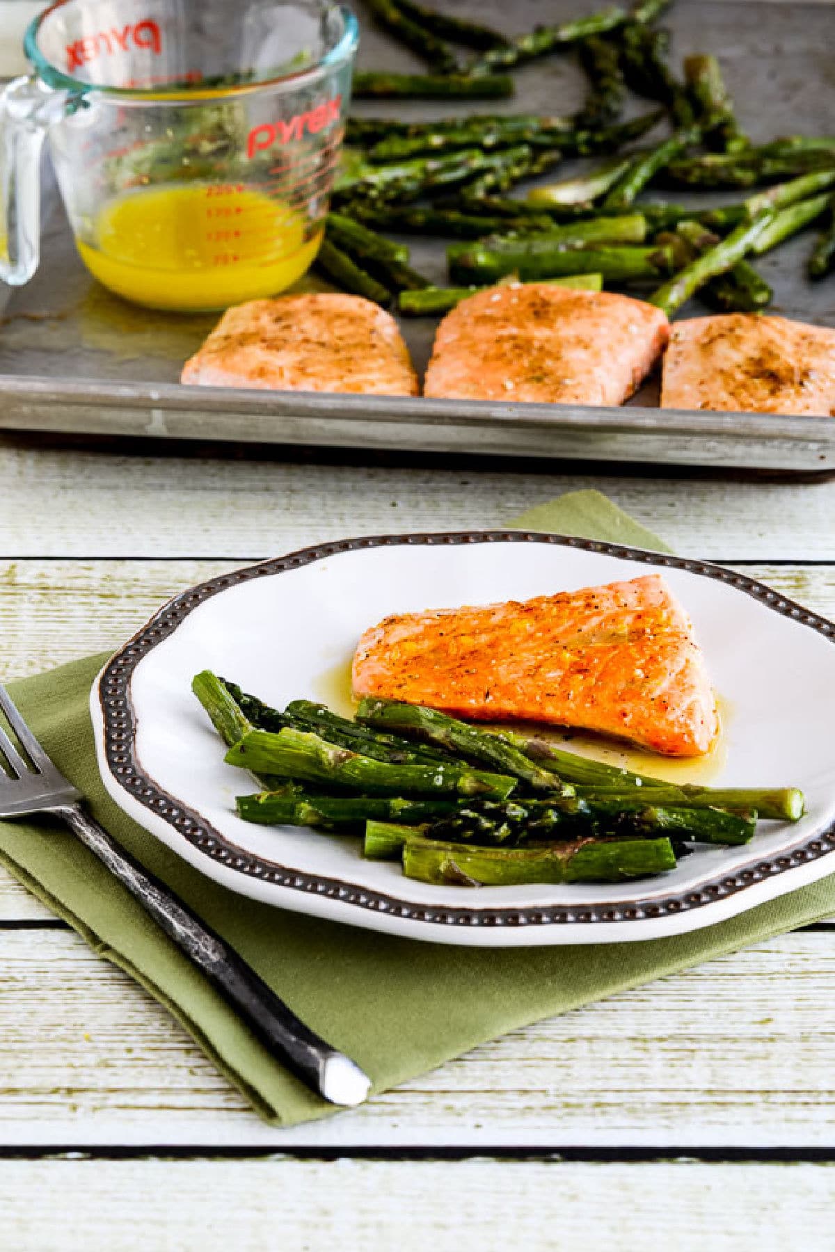 Salmon and Asparagus Sheet Pan Meal with one serving on plate