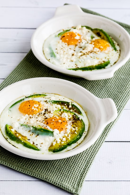 Baked Eggs with Avocado and Feta in baking dishes