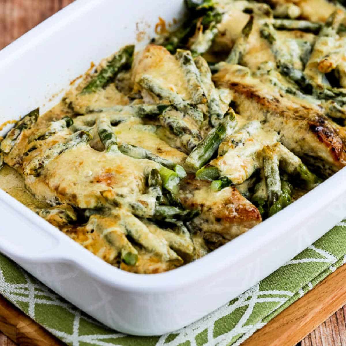 Square image of Chicken and Asparagus with Three Cheeses shown in baking dish.