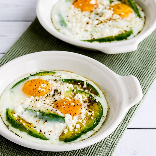 Baked Eggs with Avocado and Feta in two individual dishes
