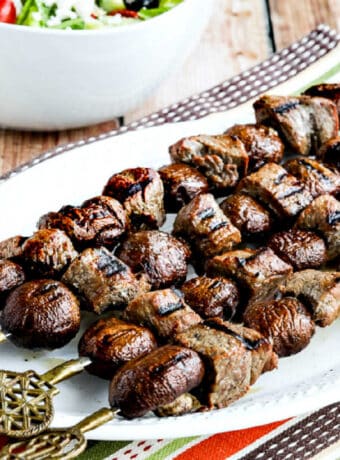 Square image for kabobs with steak and mushrooms.