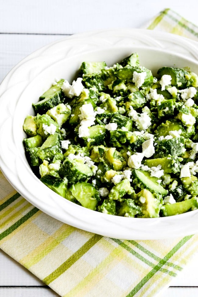 Cucumber and Avocado Salad with Lime, Mint, and Feta close-up photo of finished salad in bowl