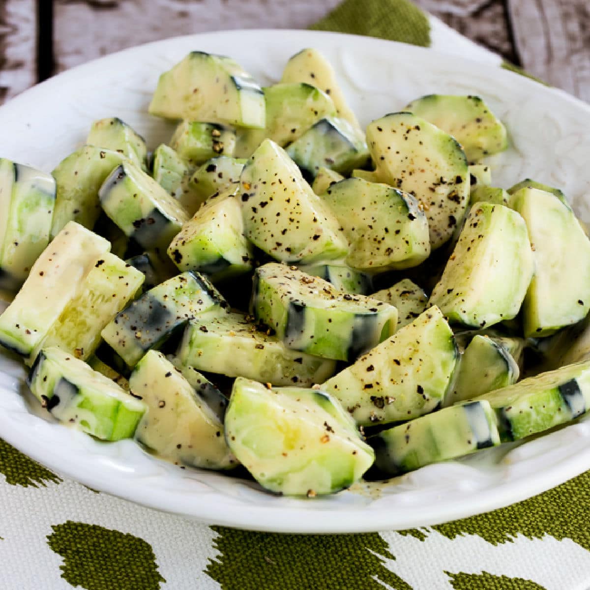 Square image for Cucumbers Caesar shown in salad bowl.
