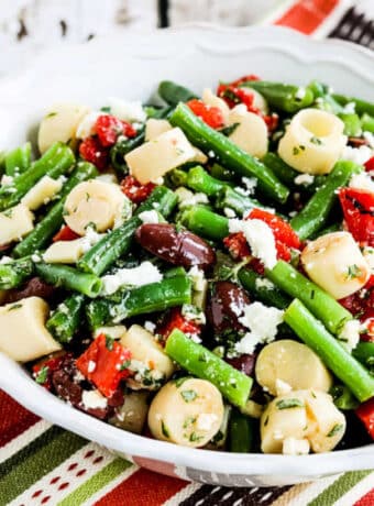 Green Bean Salad with Hearts of Palm square image of salad in serving bowl.