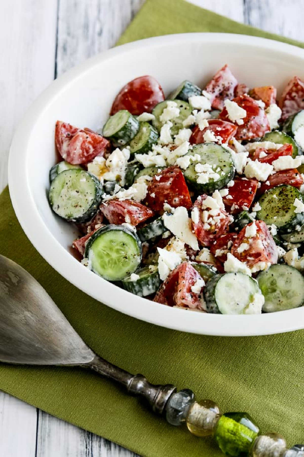 Summer lunch salad in a serving bowl with a fork