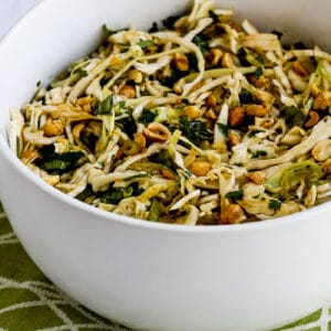 Spicy Cilantro-Peanut Slaw in serving bowl on green-white napkin
