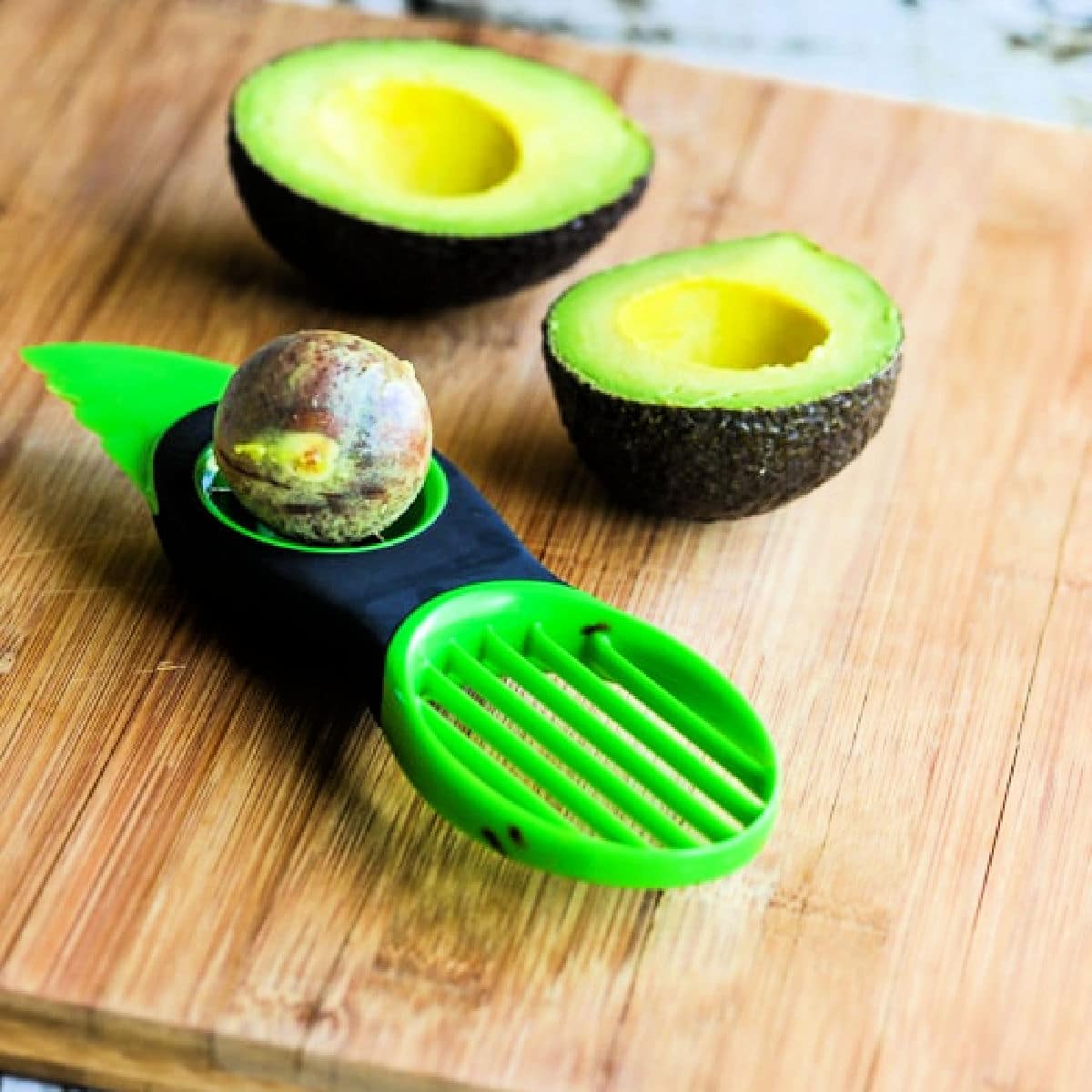 Square image for Kalyn's Kitchen Picks: OXO Avocado Tool showing avocado and tool on cutting board.