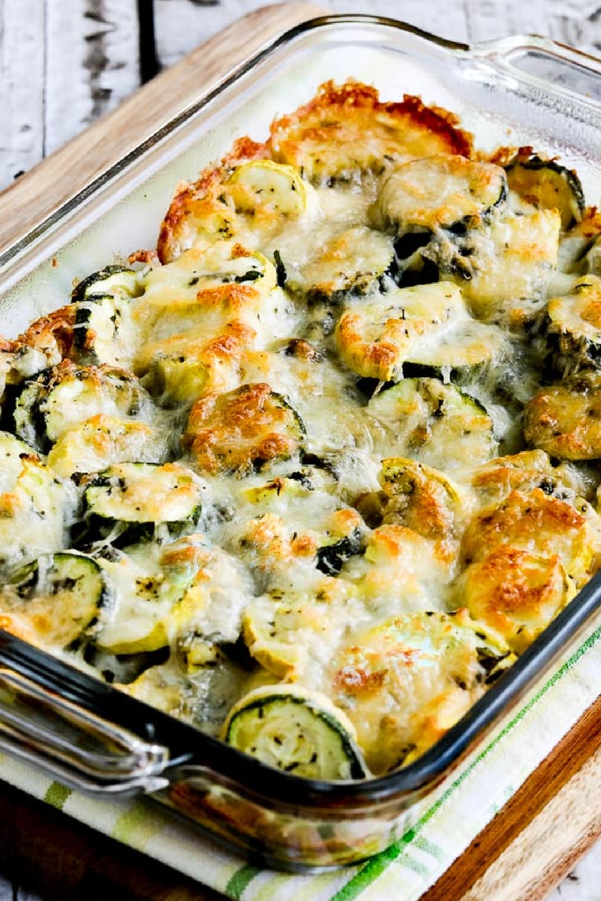 Easy Cheesy Zucchini Bake shown in baking dish with well-browned cheese