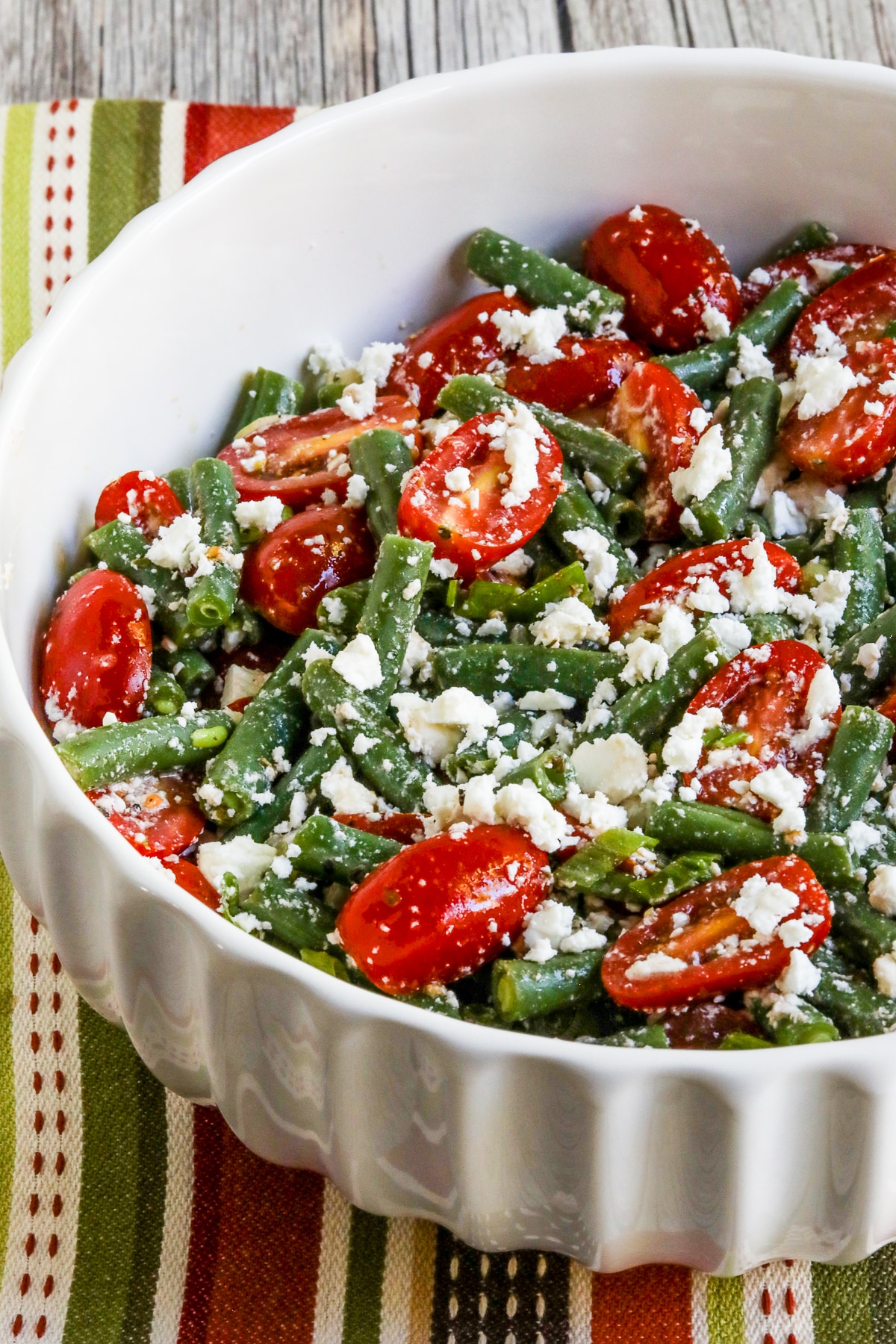 Green Bean Tomato Feta Salad close-up photo in serving bowl.