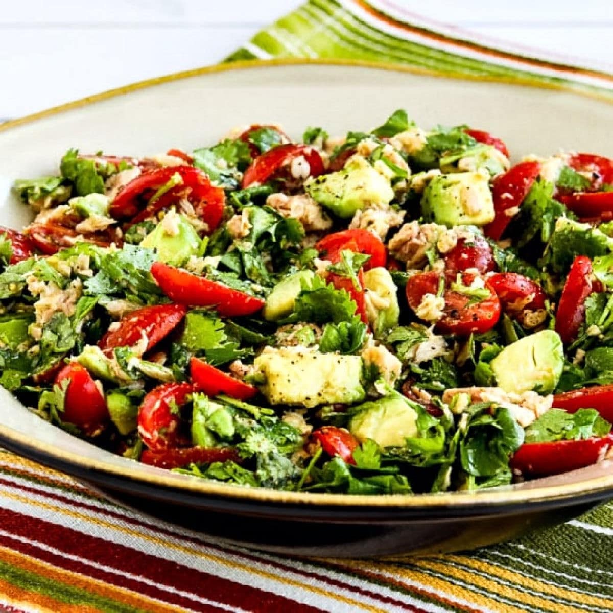 Square image for Tuna Avocado Tomato Salad on serving plate.