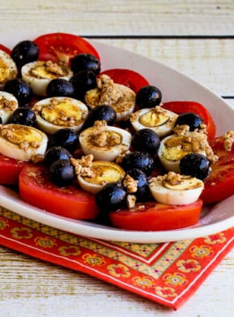 Square image for Tomato, Egg, and Olive Salad on serving plate.