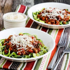 square image with two bowls of zucchini noodles with Homemade Pasta Sauce.