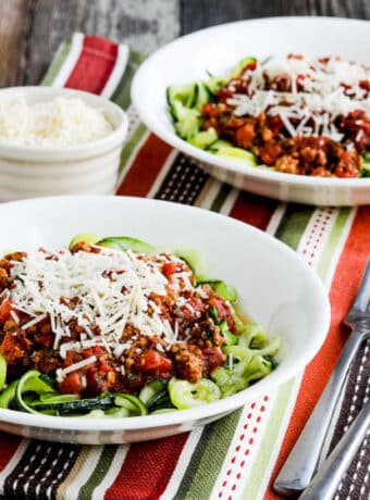 square image with two bowls of zucchini noodles with Instant Pot Pasta Sauce