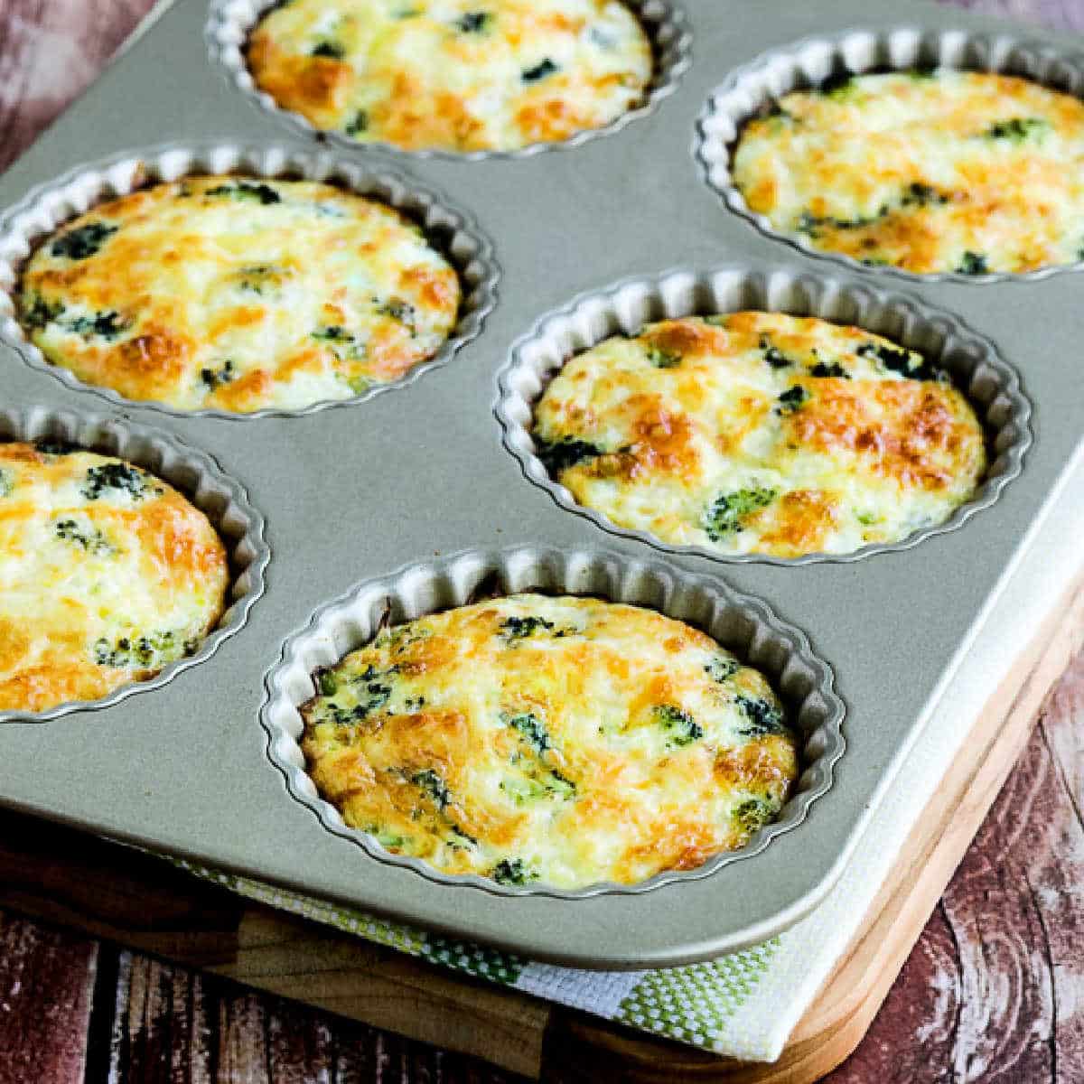 Square image of Mini Frittatas with Broccoli and Three Cheeses in tart pan.