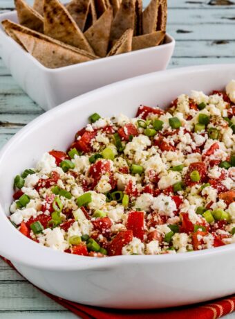 Greek Dip with Tomatoes and Feta thumbnail image of finished dip in serving dish with Pta