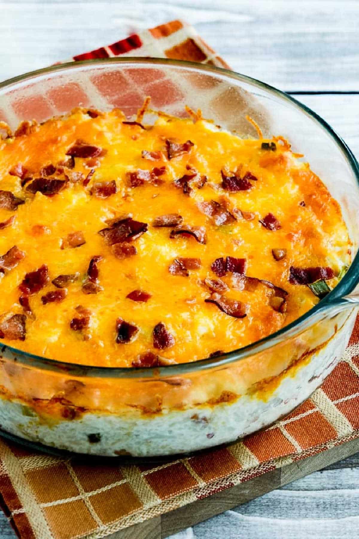 Twice-Baked Cauliflower shown in baking dish on rust colored napkin