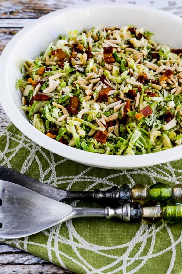 Brussels Sprouts Salad with Bacon, Almonds, and Parmesan finished salad in serving bowl