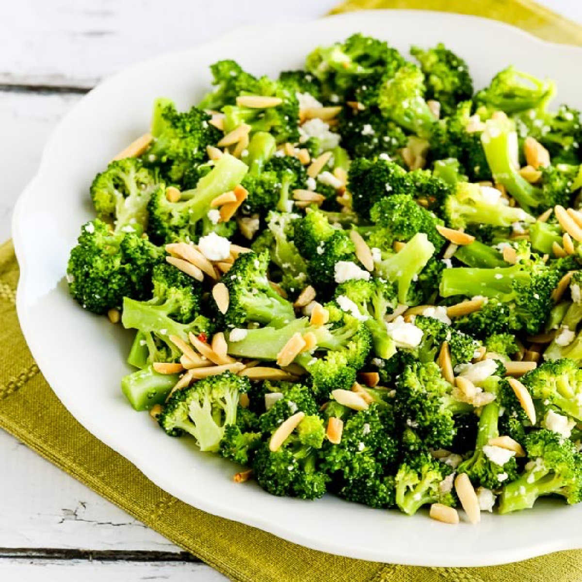 Broccoli Salad with Feta and Almonds, square image of salad in serving bowl