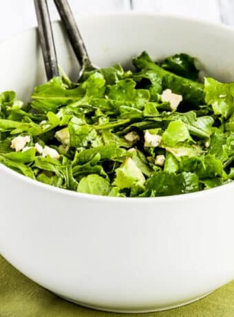 Kale and Arugula Salad shown in serving bowl.