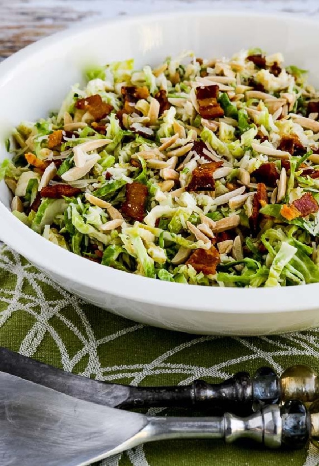 Brussels Sprouts Salad with Bacon, Almonds, and Parmesan close-up photo of salad in serving bowl