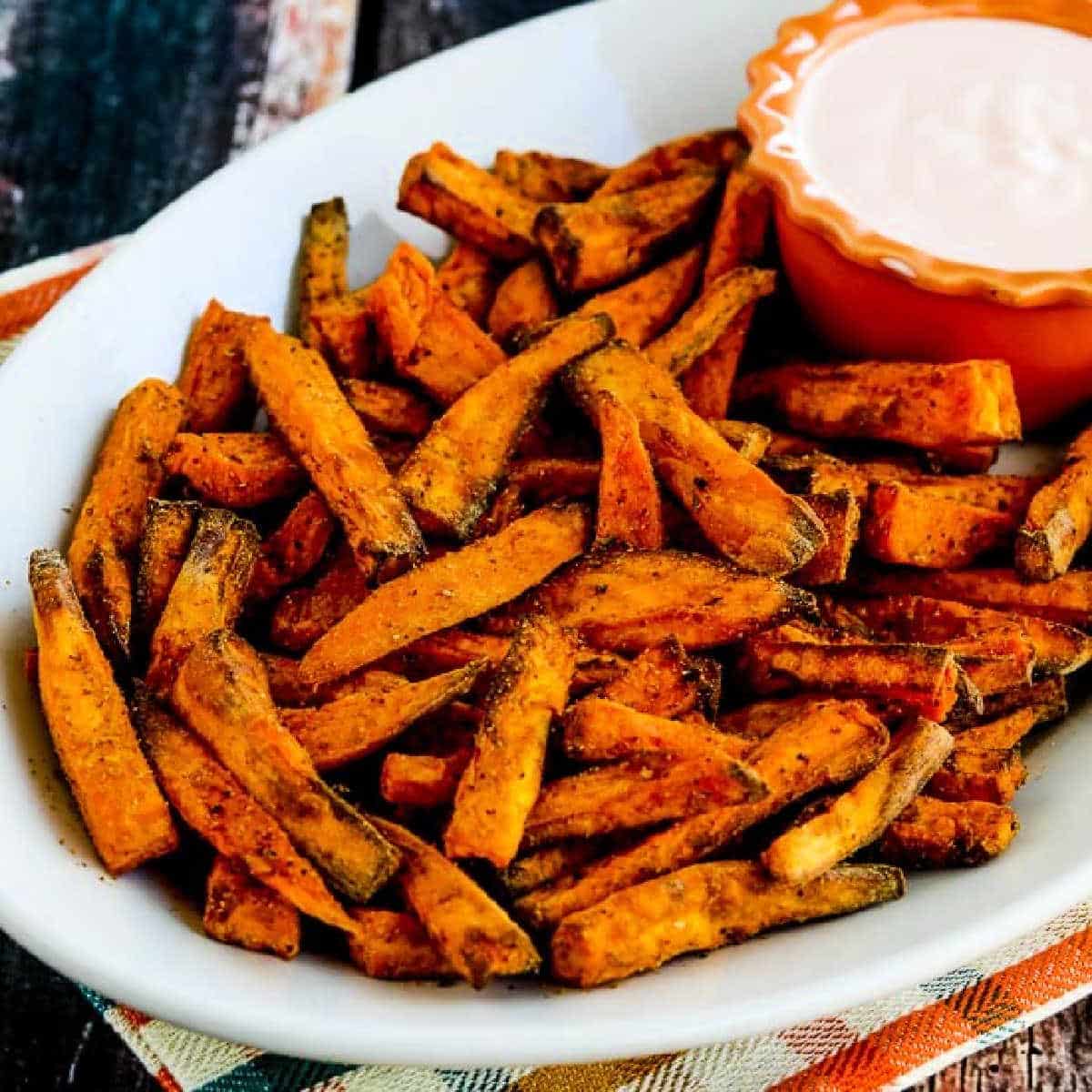 Square image for Air Fryer Sweet Potato Fries on serving plate with Sriracha Aioli Dipping Sauce.
