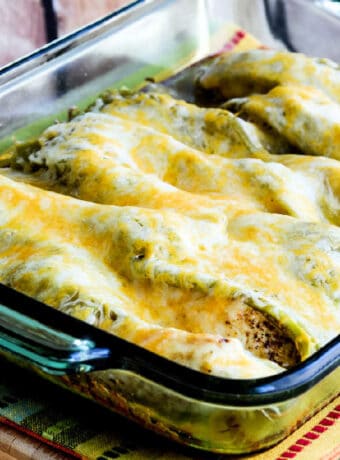 Chicken with Green Chiles and Cheese shown in baking dish with melted cheese