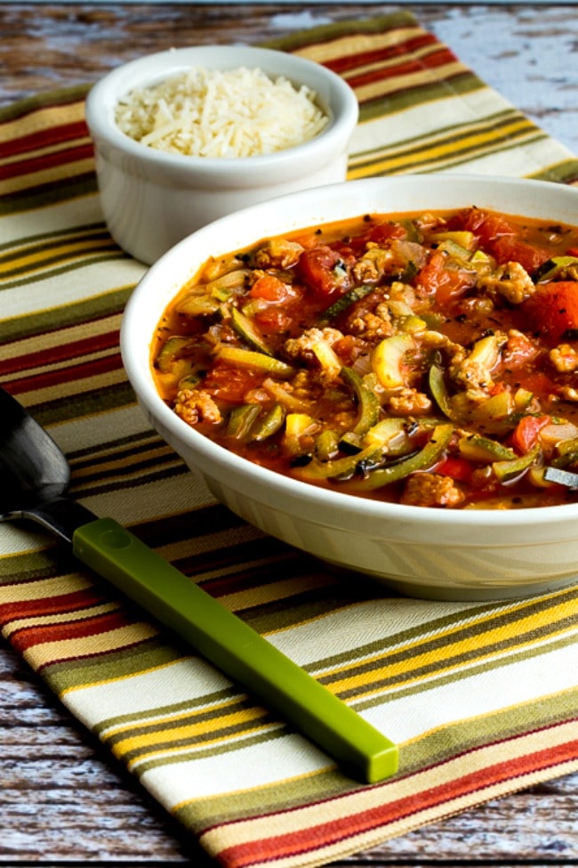 Low-Carb Italian Sausage Soup with Tomatoes and Zucchini Noodles close-up photo