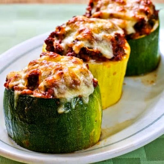 Zucchini cups stuffed with meat, tomatoes and mozzarella