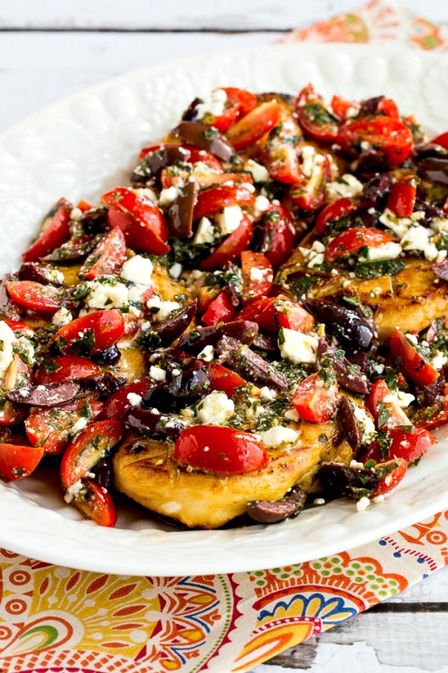 Greek Chicken with Tomato, Olive, and Feta Topping finished dish on plate