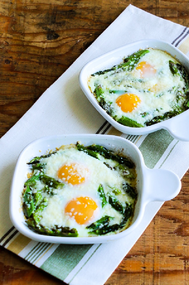 Baked Eggs and Asparagus with Parmesan finished eggs in two serving dishes
