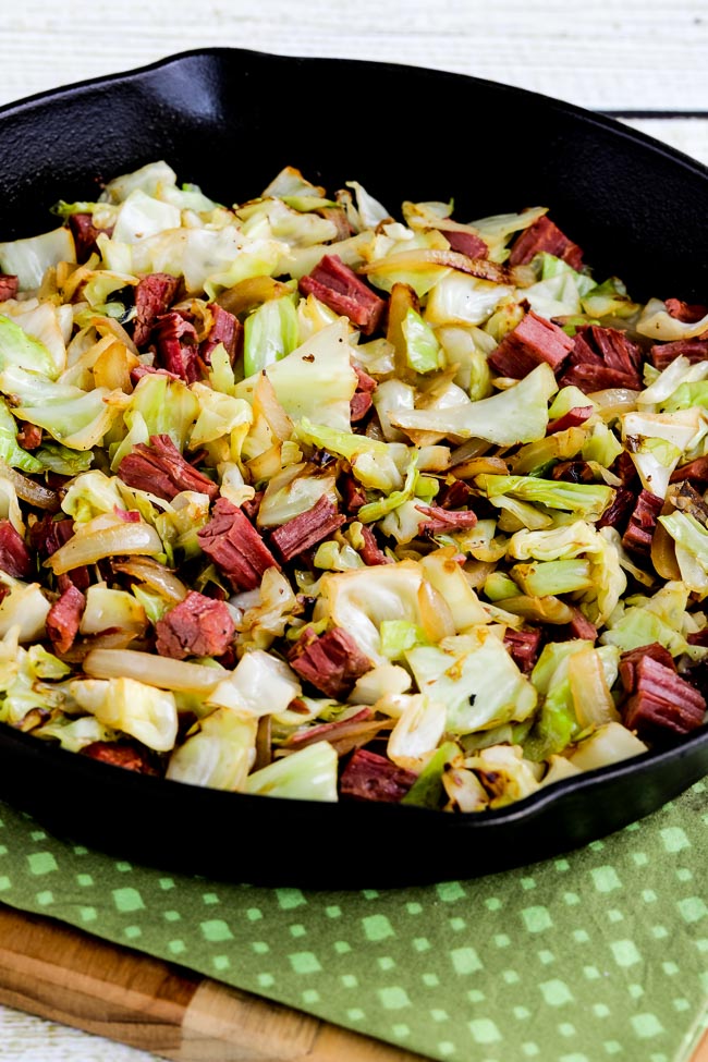 Fried cabbage with beef fried in a cast iron skillet