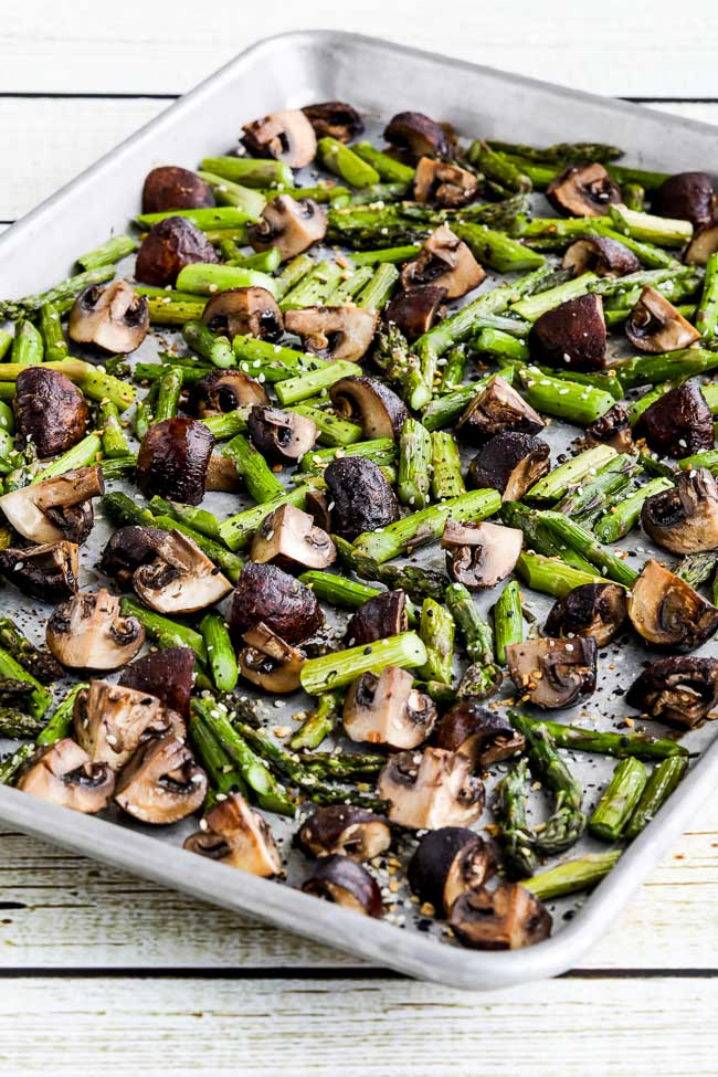 Roasted Asparagus and Mushrooms shown on sheet pan