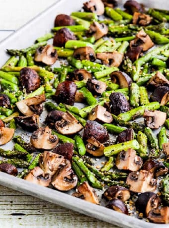 Square image of Roasted Asparagus and Mushrooms shown on sheet pan.