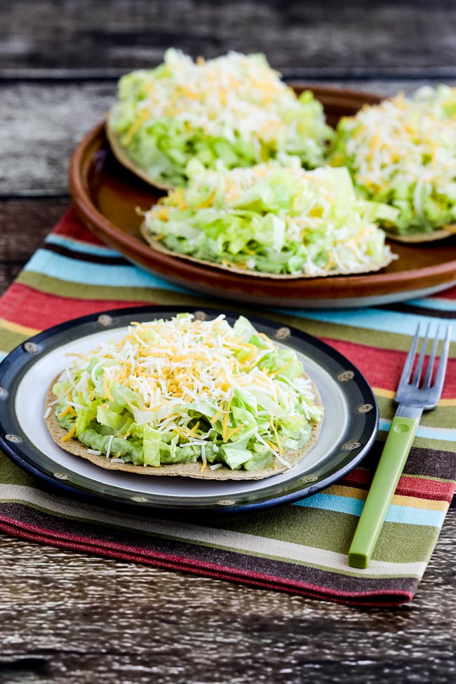 Easy Low-Carb Guacamole Tostadas finished tostada on serving plate