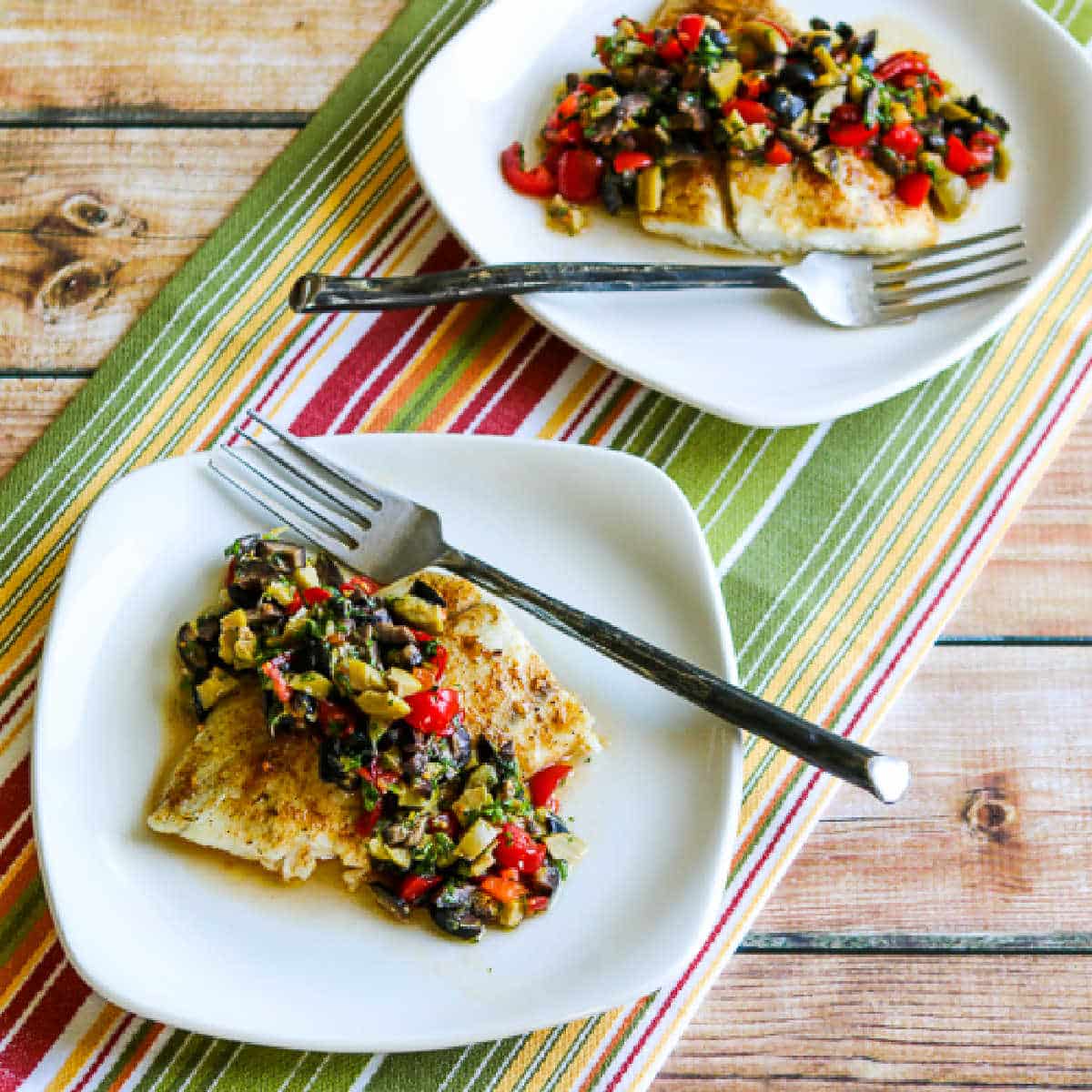 Roasted Barramundi with Tomato and Olive Relish with fish shown on two serving plates