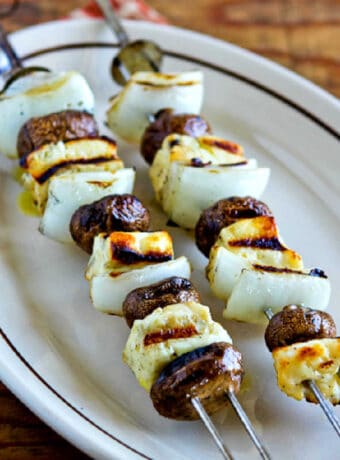 square image of Grilled Halloumi Cheese with Mushrooms on serving platter