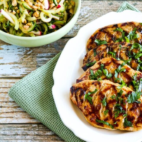 Low-Carb Grilled Fusion Chicken on serving plate with cucumber noodle salad on the side