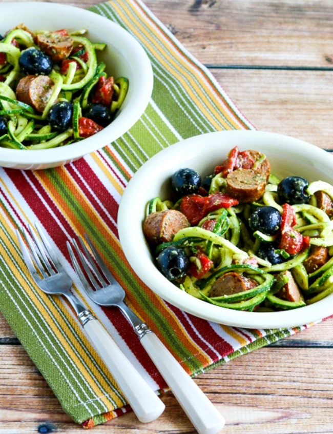 Zucchini Noodle Mock Pasta Salad in two serving bowls with forks