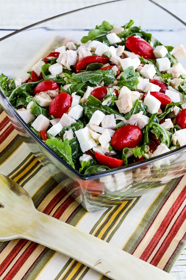 Baby Arugula Salad with Chicken, Mozzarella, and Tomatoes finished salad in serving bowl