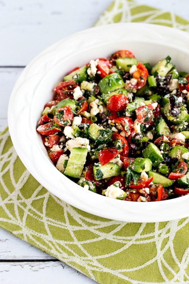 Tomato Cucumber Salad with Mint and Feta in serving bowl
