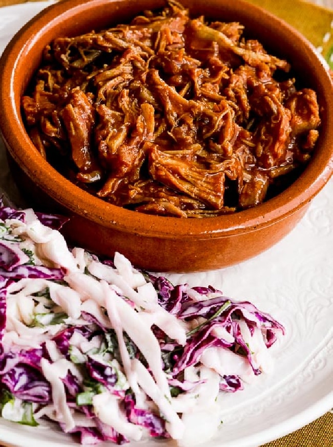 Low-Carb Instant Pot Pulled Pork on serving plate with slaw