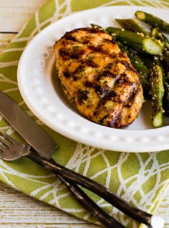 Rosemary Mustard Grilled Chicken on serving plate with asparagus